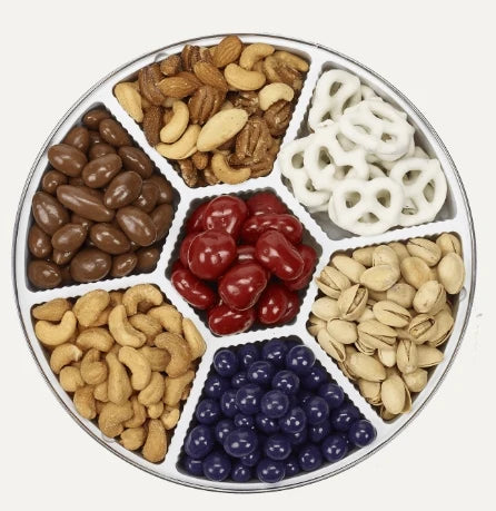 Tin includes Roasted Salted Cashews, Honey Roasted Peanuts, Chocolate Blueberries, Yogurt Pretzels, Deluxe Mixed Nuts, Chocolate Covered Almonds, and Chocolate Cherries